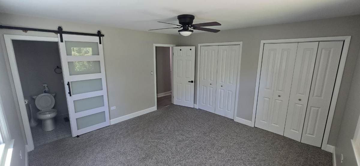 White barn door installed for a bedroom bathroom opening by BAX
