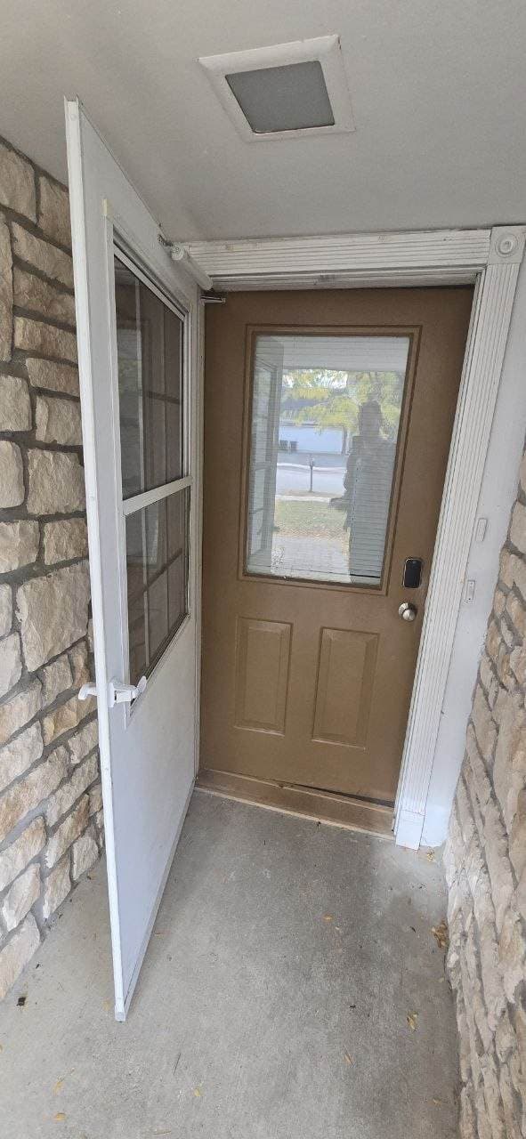 Front storm door and entry door installation area completed by BAX